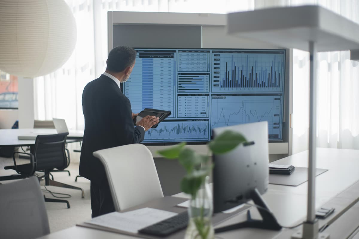 Business executive analyzing AI data and making strategic decisions